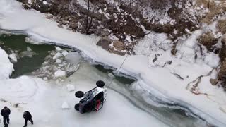 Pulling an ATV Out of a Frozen River with Crane