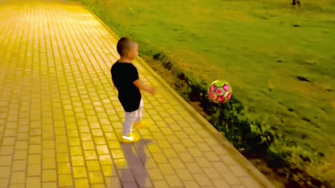 Baby playing foot ball