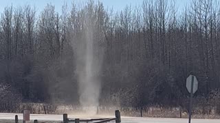 Dust Devil Rises High Into the Sky