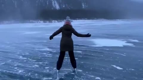 Ice skating on a frozen lake.