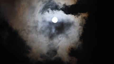 Moon rise through Clouds