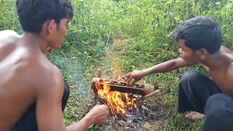 Cooking Crabs And Snails in bamboo