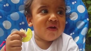 Baby's first time ever tasting a lemon