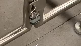 Subway station lock on small gate is pointless