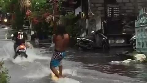 Surfer Enjoys the Rainy Season