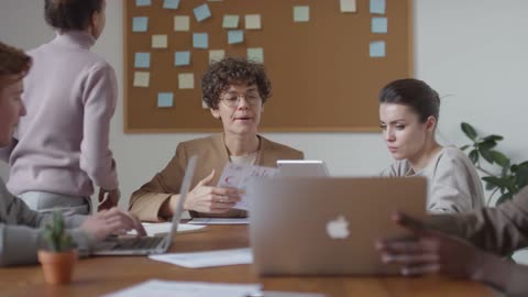 A Busy Time Lapse Video of a Woman Staying Behind After A Business Meeting.