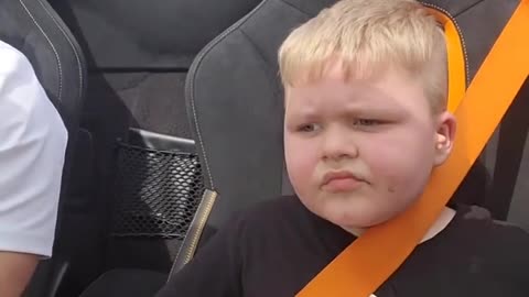 Kid both scared and thrilled after speedy car experience