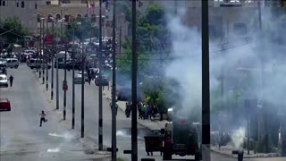 Israeli forces fire teargas at protestors