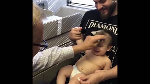 Doctor distracts baby from her shots with goofy tune