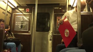 Old man white shirt reading and tearing apart big book