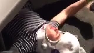 Trampoline jumper in striped shirt tries to jump onot table and hits head wearing white helmet