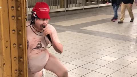 Man naked suit red hat screaming on subway station