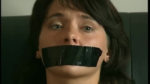 Russian beauty with her mouth covered with black tape