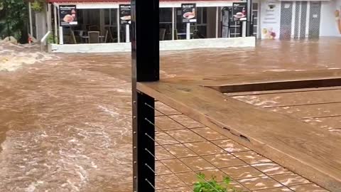 Floods Turn Creek Into Raging Torrent