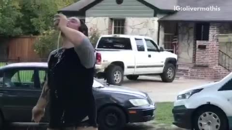 Guy uses a hockey stick to throw a beer to friend