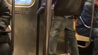 Guy dances by himself in subway train