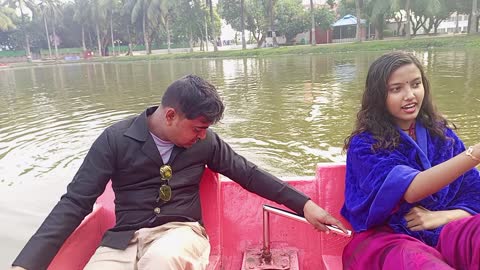 Boat ridding in the park pond.