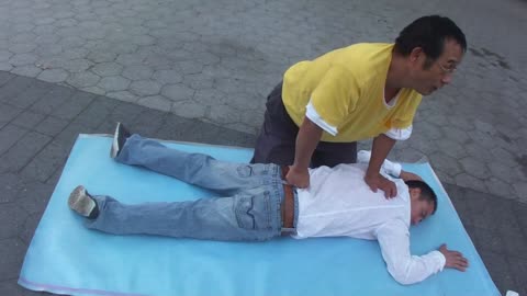 Luodong Massages Man In White Shirt On Sidewalk