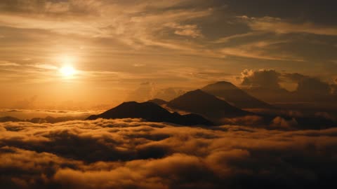 Drone Footage of Mountain Peaks in a Sea of Clouds