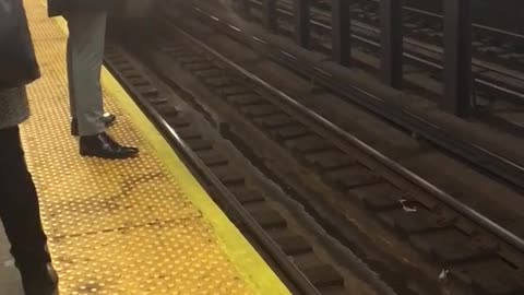 Black fedora hat man stands way too close to subway