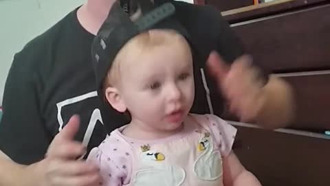 Baby wants to be cool like Dad