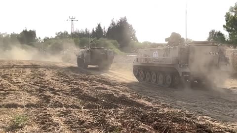 Israeli tanks move through the Sderot area