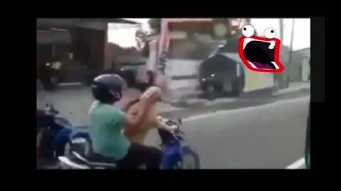 The dog rides his motorbike so well that his master is on the street.