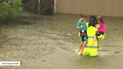 Image Of Deputy Rescuing Two Children From Houston Flood Waters Goes Viral