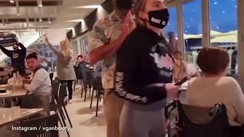 Vegan activist bursts into a seafood restaurant yelling about a 'fish holocaust'