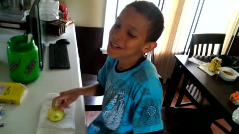 Boy Smashes Apple With His Head
