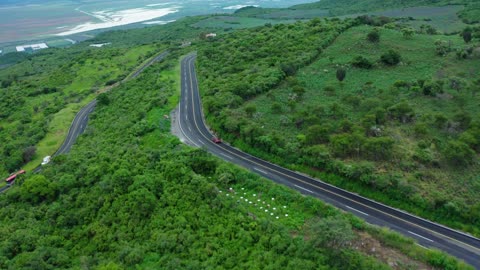 curvy road on a tree covered hill