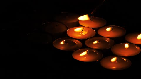 Lighting candles in the dark