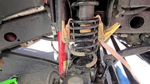 Using endless lashing straps to compress springs. TRY AT YOUR OWN RISK