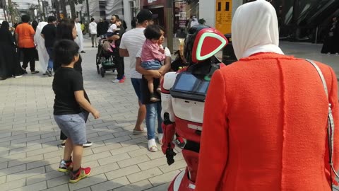 Robot with Human in the Shopping Mall