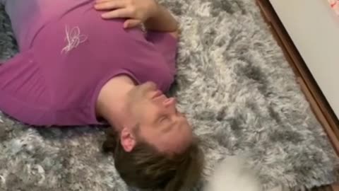 Compassionate Cat Nudges Owner After A Play-Dead Prank
