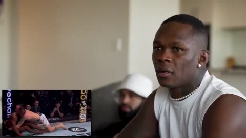 Israel Adesanya Reacts to WILD UFC 296 PPV & Sean vs Dricus Fighting in the Crowd