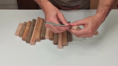 Thread The Stick Into The Iron Bar With The Spiral Pattern