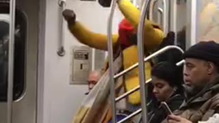 Man yellow jacket red beanie dancing