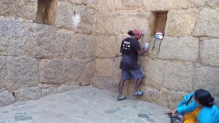 Man Climbs Stone Wall with Extreme Speed