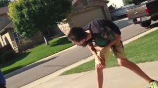 Driveway basketball kid tries to shoot between legs hits groin