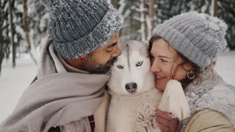 Couple Kissing cute dog