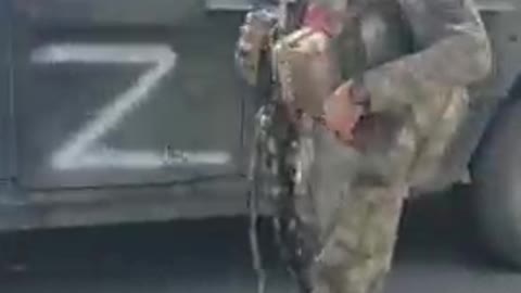 Ukraine War - A Chechen soldier and a captured Humvee from Lisichansk