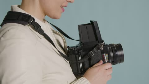 Side view of photographer using medium format camera 02