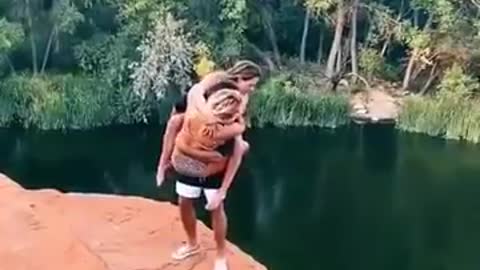 Three people doing awesome cliff jump