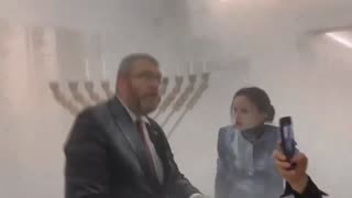 MP Grzegorz Braun extinguishes Jewish Hanukkah candles at Poland's parliament