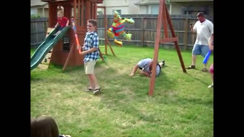 Dizzy Man Tries To Hit Pinata, Falls Over And Over Again