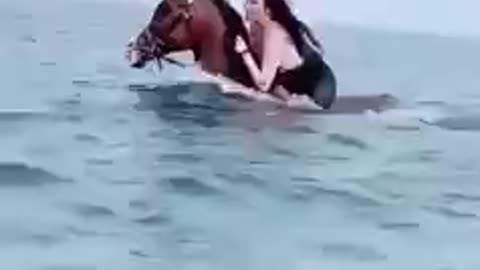 RIDING HORSE IN THE SEA