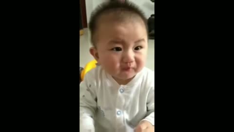 Enjoy cute baby eating lemon.