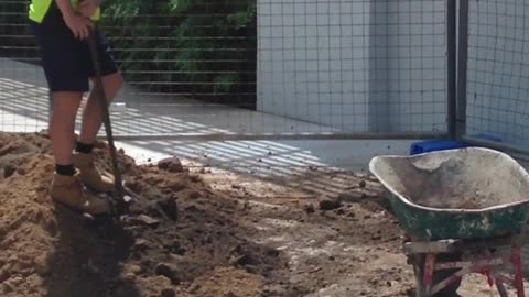 LAZY TRADIE FILLING WHEEL BARROW