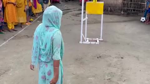 Funny challenge of throwing ball. Village Women winning useful Rewards